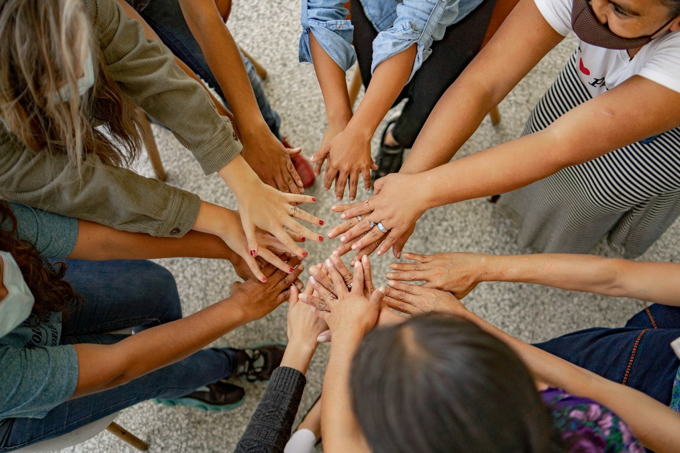 People joining hands in a gesture of solidarity